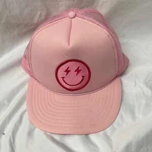 Lightning bolt smiley face trucker hat pink